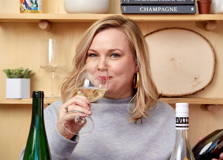 Amy Waller enjoying a glass of white wine at the wine bar